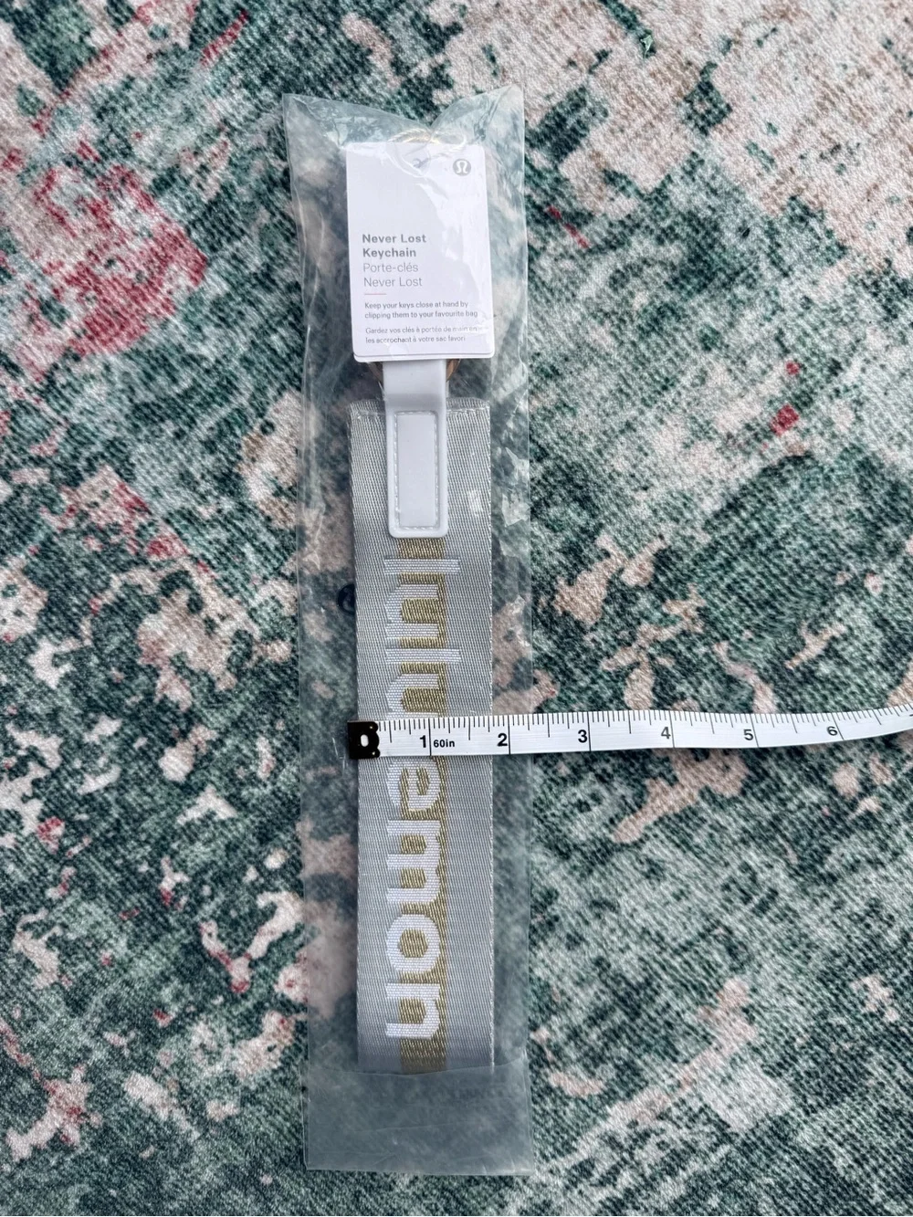 lululemon athletica Never Lost Keychain Lanyard in light grey with Gold Logo